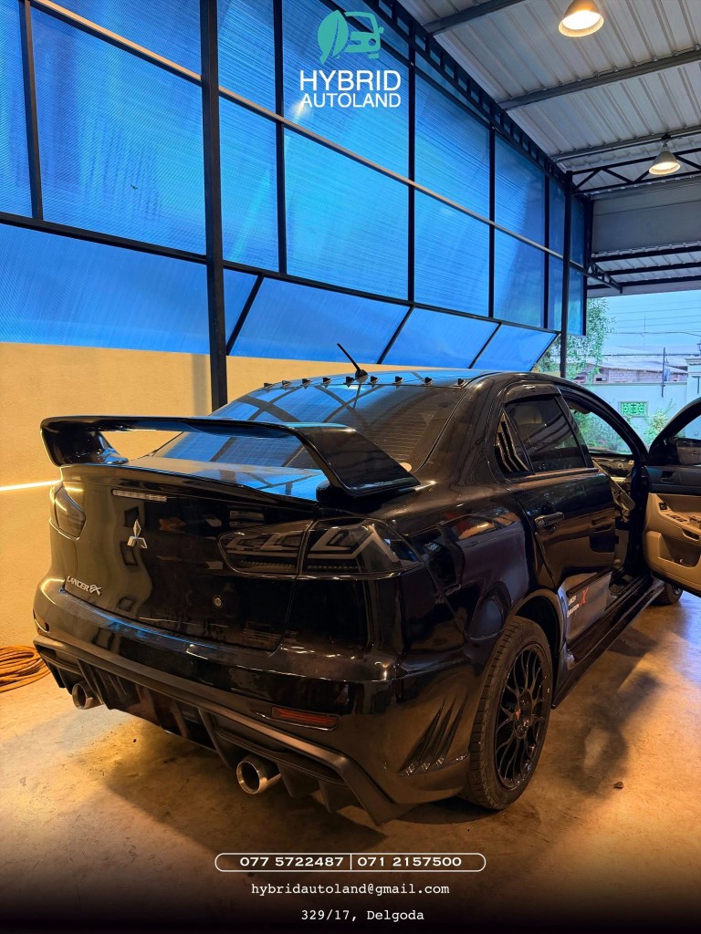 Black Mitsubishi Lancer in the workshop